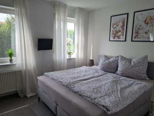 a bedroom with a bed and a window at Ferienwohnung Panoramablick in Bad Mergentheim
