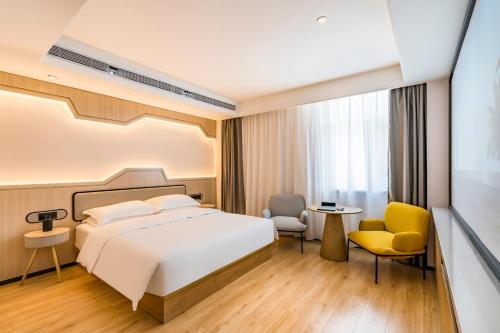 Ein Bett oder Betten in einem Zimmer der Unterkunft VYLUK Hotel Beijing Universal Studios-蔚徕酒店 北京环球影城店