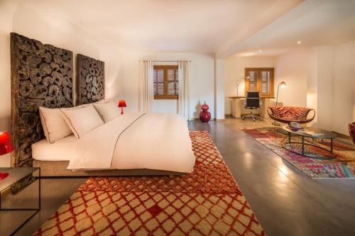 a bedroom with a large bed and a living room at Modern 5 Bedroom Villa in Selva, 1455 in Selva