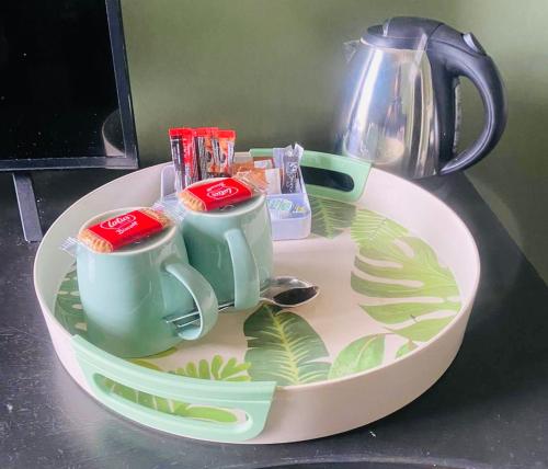 a plate with two cups on top of a table at horn and trumpet in Bewdley