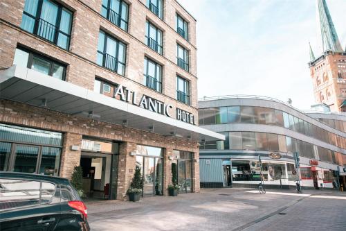 a car parked in front of a building at ATLANTIC Hotel Lübeck in Lübeck