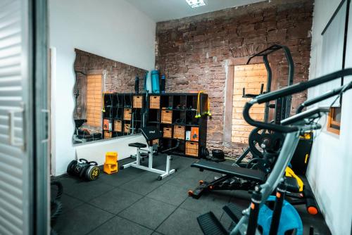 a room with a gym with a brick wall at Spessart Oase in Marktheidenfeld