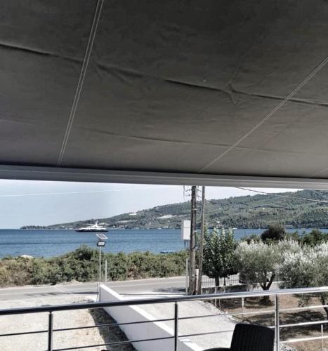 a view of a body of water from a balcony at Maurizio's Villa in Yiáltra