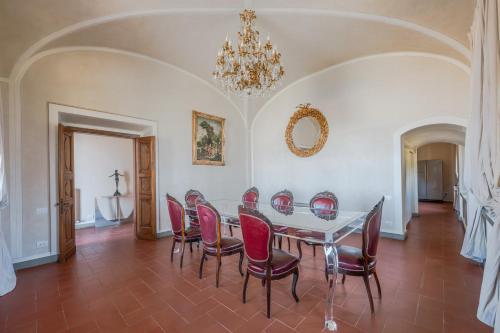 a dining room with a table and chairs at Villa Leonardo - Vinci in Vinci