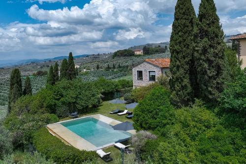 an aerial view of a house with a swimming pool at Villa Leonardo - Vinci in Vinci