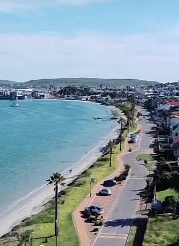 a view of a beach with buildings and the ocean at West Coast Escape in Saldanha
