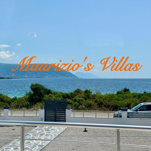 a sign that reads marina and villas next to the ocean at Maurizio's Villa in Yiáltra