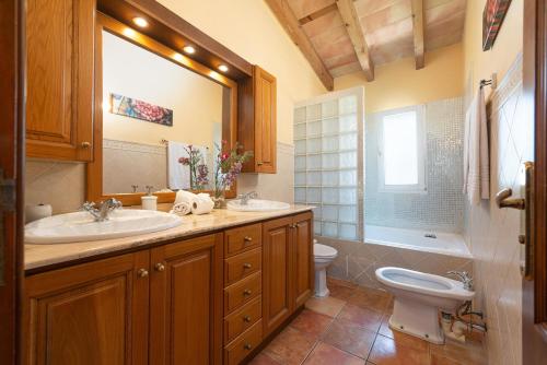 a bathroom with a sink and a toilet at Finca Kelly in Artá