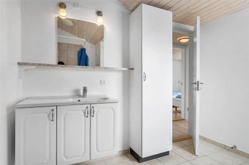 a white bathroom with a sink and a mirror at 618-Thisted-Fiskervej-82 in Thisted