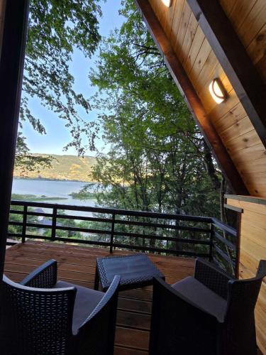 a porch with chairs and a view of the water at Visitor Place in Plav