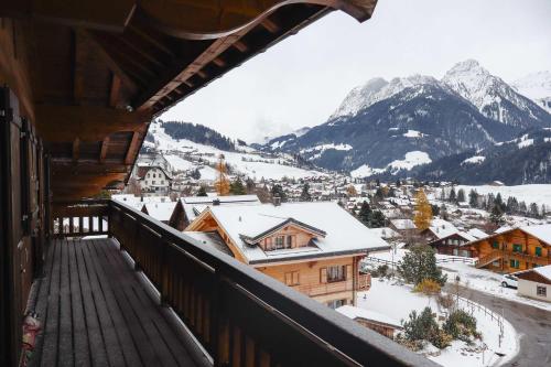 a balcony with a view of a snowy mountain at Chalet Bliss with Spectacular Views in Chateau-d'Oex