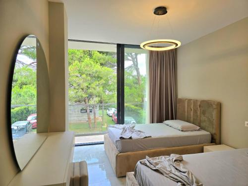 Un pat sau paturi într-o cameră la Villa Gardenia 2