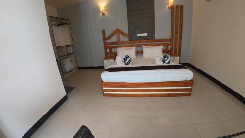 a bedroom with a large bed in a room at Liberty Guesthouse Maldives in Mahibadhoo