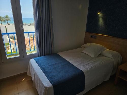 Katil atau katil-katil dalam bilik di Hotel Punta del Cantal