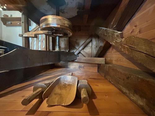 a wooden bench sitting on the floor in a room at Familienbauernhof Gunzer-Sank in Eberstein