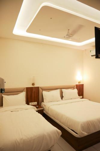 Katil atau katil-katil dalam bilik di Hotel Royal Anandraj