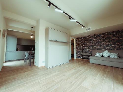 a living room with a couch and a table at Fiore di Langa - Residence in Monforte d'Alba in Monforte dʼAlba
