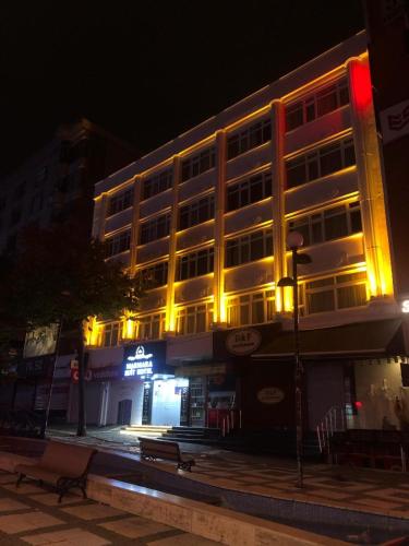 a large building with lights on it at night at Marmara Suit Hotel in Avcılar
