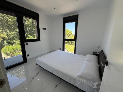 Ένα ή περισσότερα κρεβάτια σε δωμάτιο στο Amazing Luxury Villa