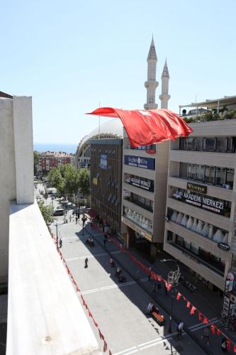 an overhead view of a building with a red umbrella at Marmara Suit Hotel in Avcılar
