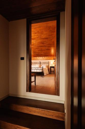a view of a room through a window with a table at Alle tre Colline in Albugnano 