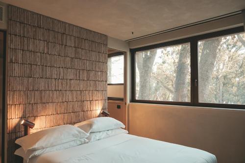 Ένα ή περισσότερα κρεβάτια σε δωμάτιο στο Casacon Music Hotel Sirolo