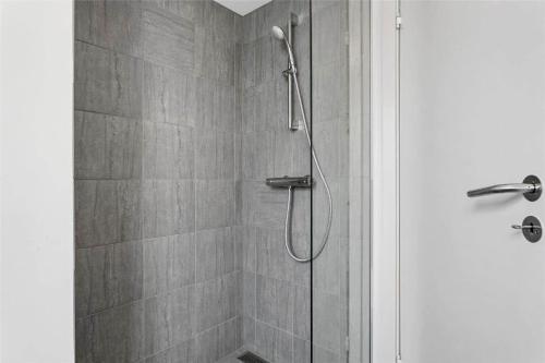 a shower with a shower head in a bathroom at 785-Thisted-Havstokken-32-A in Thisted