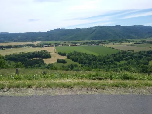 a view of a green field with mountains in the background at Gite De La Fermette Aubepines in Rentières