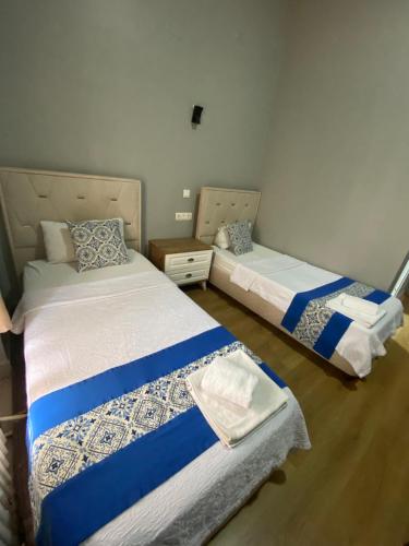 Un ou plusieurs lits dans un hébergement de l'établissement Dünya Otel Adana