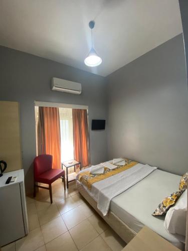 Un ou plusieurs lits dans un hébergement de l'établissement Dünya Otel Adana