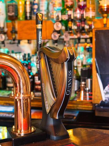 a bottle opener sitting on top of a bar at horn and trumpet in Bewdley