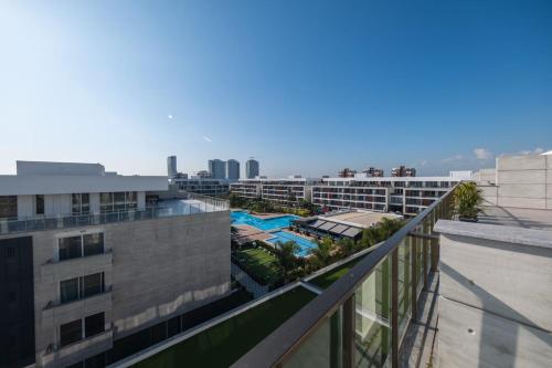 a view from the balcony of a building at xo courtyard long beach in Iskele