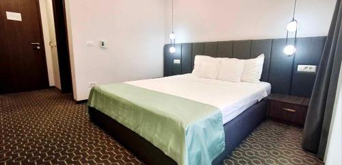 Ένα ή περισσότερα κρεβάτια σε δωμάτιο στο Roa Guesthouse