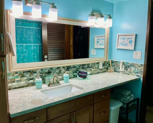 a bathroom with a sink and a mirror at C206 - Sapphire Beach - Sapphire Jewel VI in East End
