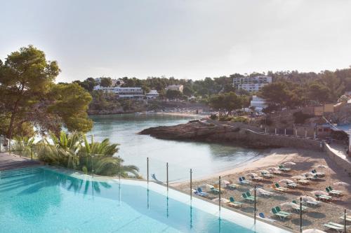 a view of a body of water with a beach at Grupotel Ibiza Beach Resort - Adults Only in Portinatx