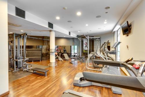 a gym with treadmills and elliptical machines at Spa & Wellness Hotel Diament Ustroń in Ustroń