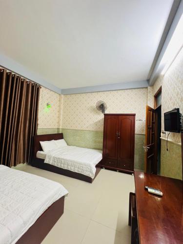 Ένα ή περισσότερα κρεβάτια σε δωμάτιο στο Nhà nghỉ THANH TRÚC