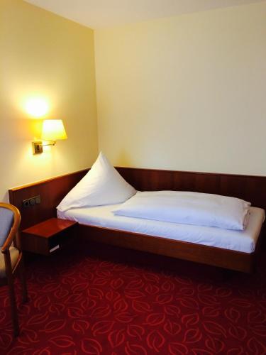 Postel nebo postele na pokoji v ubytování Hotel Gasthaus Adler