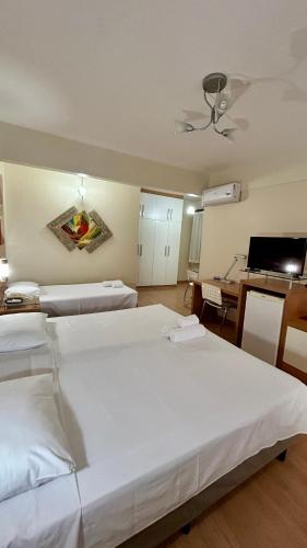 Ένα ή περισσότερα κρεβάτια σε δωμάτιο στο Líber Hotel Nova Serrana - Conforto na Rota da BR-262