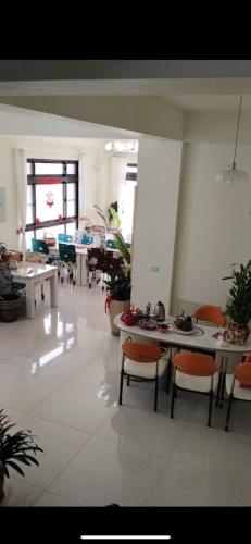 a room with tables and chairs in a building at Shanhai B&B in Jinning