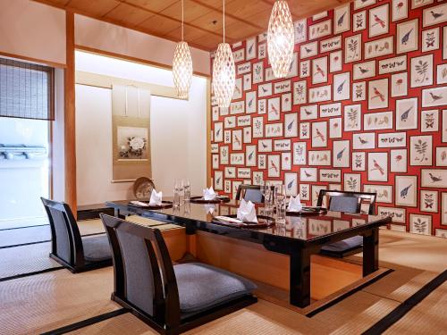 a dining room with a long table and chairs at Grand Hotel Wien in Vienna