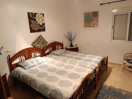 a bedroom with a large bed in a room at The terraces in Bácor