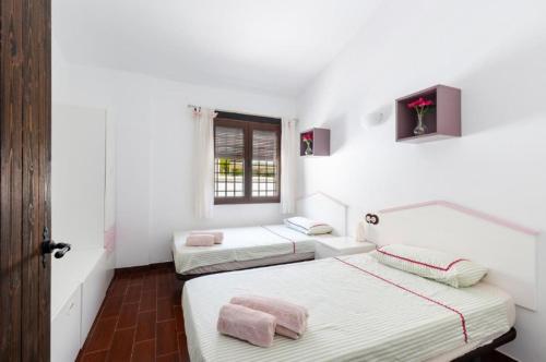 Ένα ή περισσότερα κρεβάτια σε δωμάτιο στο Villa Jardines de Cope