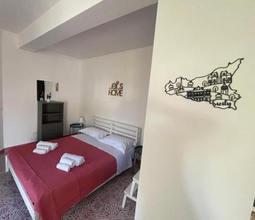 a bedroom with a bed with a train sticker on the wall at Adele Garden in Taormina