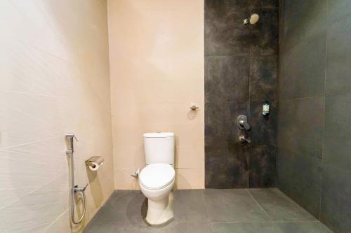a bathroom with a toilet and a shower at Rococo mandrem beach resort in Old Goa