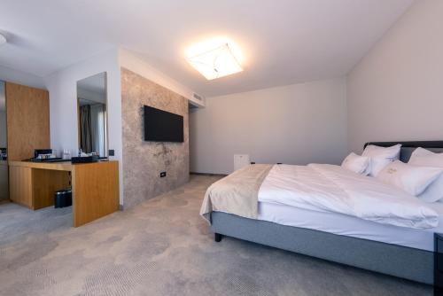 Ένα ή περισσότερα κρεβάτια σε δωμάτιο στο ONE Hotel
