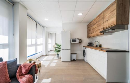 a kitchen with white cabinets and a counter at 1 Bedroom Stunning Apartment In Grao De Castellon in Grao de Castellón