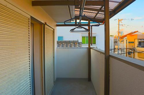 an empty balcony with a view of a building at 空月の庵 in Osaka