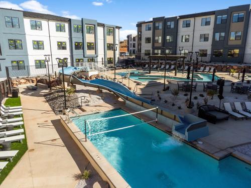 an image of a swimming pool in a apartment complex at Pool & Sunshine Retreat - Resort-style Amenities in Hurricane