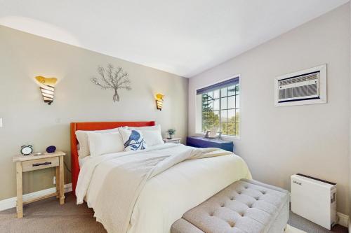 a bedroom with a large bed and a window at Lakeview Lookout in Skyforest